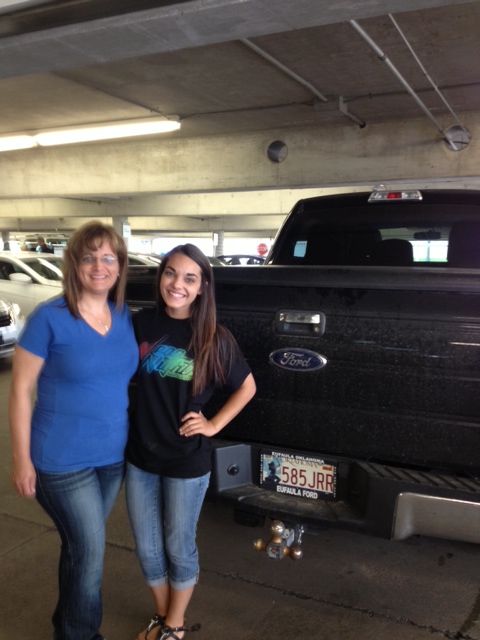 Callie and her mom, Sheila, posing at the Tulsa airport